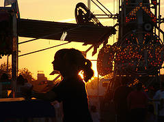 2 backlit fairgoers