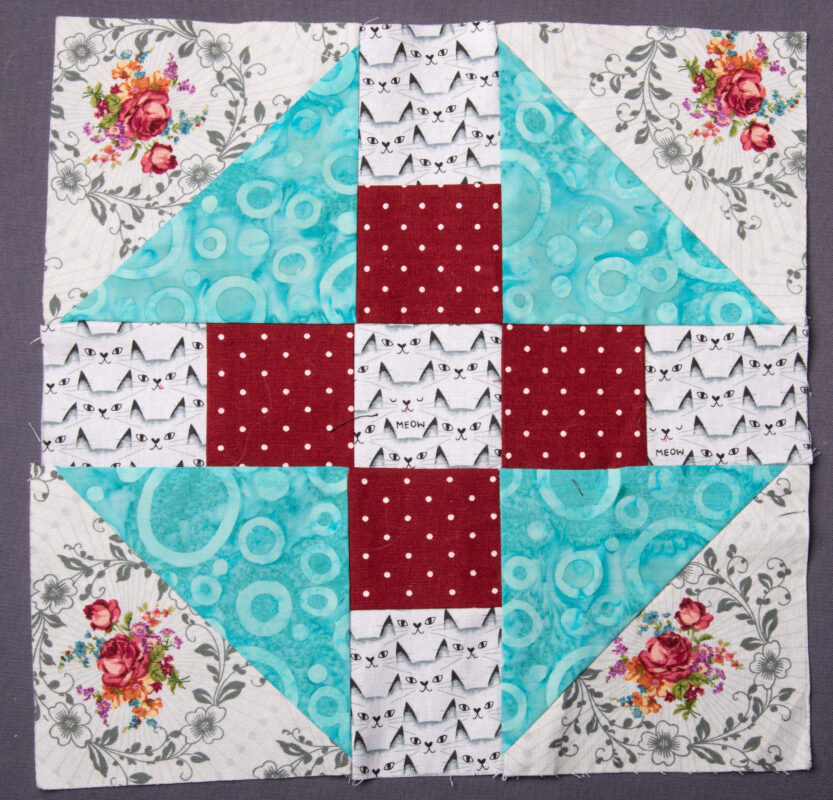 This is a 10" block, derived from the Big Churn block. Missouri Quilt released this design and called it Spring Rain.
Mine is called Spring Rain with Cats