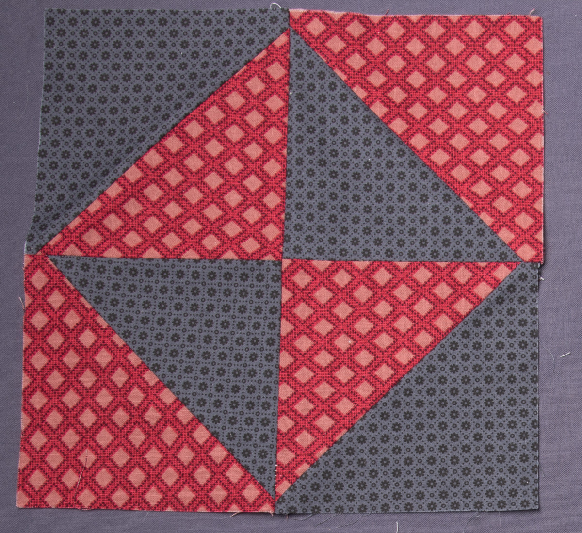 Masculine looking block with strong red and black fabrics